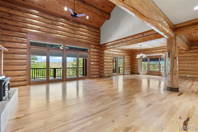 3333 State Highway 177, Cape Girardeau, MO 63701 - unfurnished living room featuring a wood stove, a chandelier, rustic walls, wood finished floors, and wood ceiling