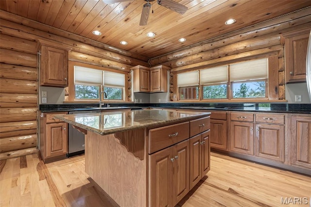 3333 State Highway 177, Cape Girardeau, MO 63701 - kitchen featuring a sink, a center island, recessed lighting, light wood finished floors, and dark stone countertops
