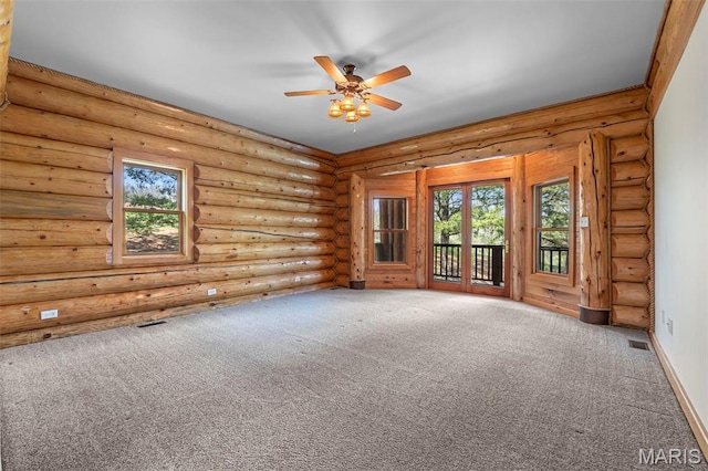 3333 State Highway 177, Cape Girardeau, MO 63701 - carpeted spare room featuring plenty of natural light, a ceiling fan, and log walls