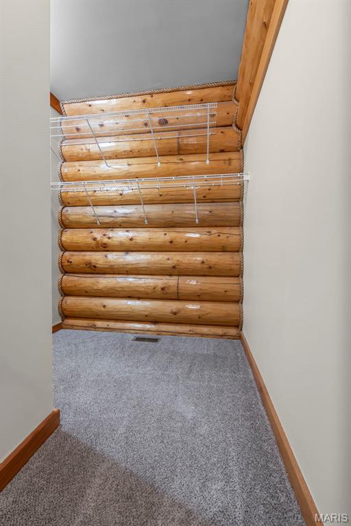 3333 State Highway 177, Cape Girardeau, MO 63701 - additional living space featuring rustic walls, baseboards, and carpet