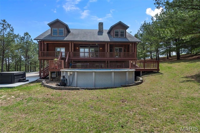 3333 State Highway 177, Cape Girardeau, MO 63701 - back of house featuring a hot tub, a chimney, stairway, a wooden deck, and log siding