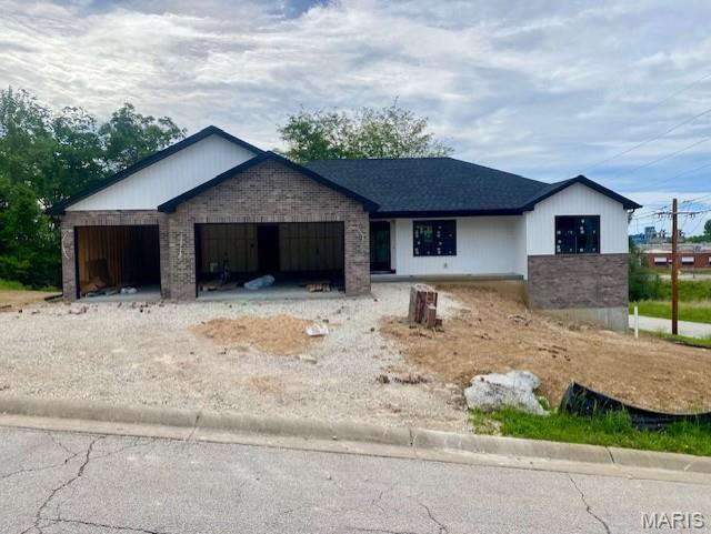 101 Carmel Ln, Washington, MO 63090 - view of front facade with a garage and driveway