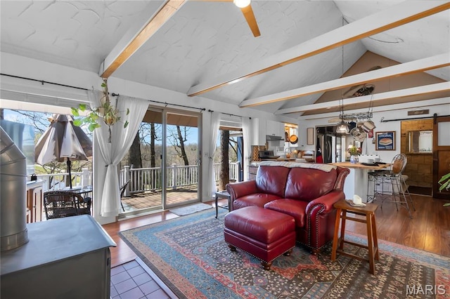 living room with a ceiling fan and wood finished floors