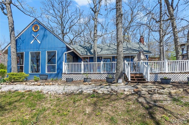 276 Cheyenne Ln, Perryville, MO 63775 - rear view of house featuring a chimney, covered porch, and a deck