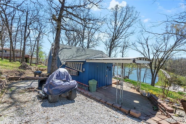 276 Cheyenne Ln, Perryville, MO 63775 - view of side of home featuring a deck, board and batten siding, and roof with shingles