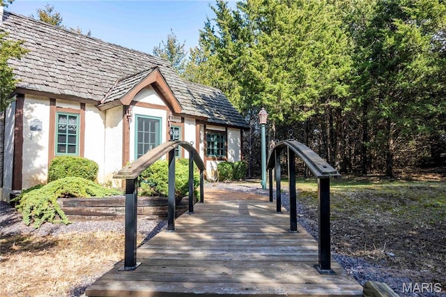view of property's community featuring a wooden deck