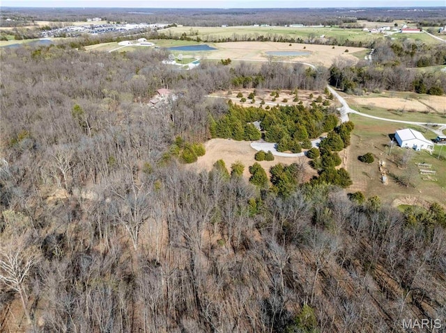aerial view of property and surrounding area featuring rural landscape