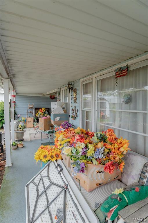 view of patio featuring a porch