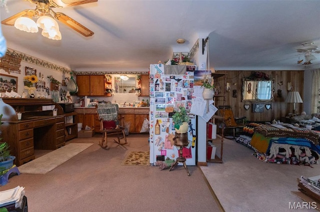 living room with light carpet and a ceiling fan