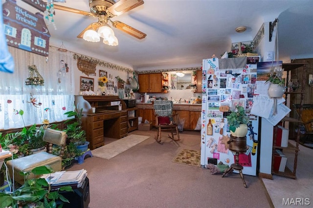 office featuring light colored carpet and ceiling fan