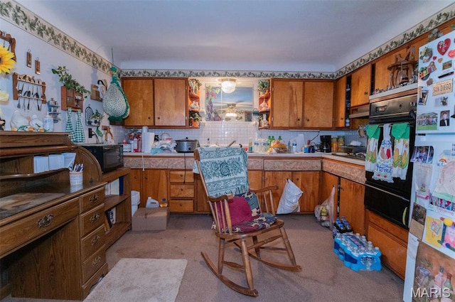 kitchen with brown cabinets, black appliances, open shelves, decorative backsplash, and light countertops