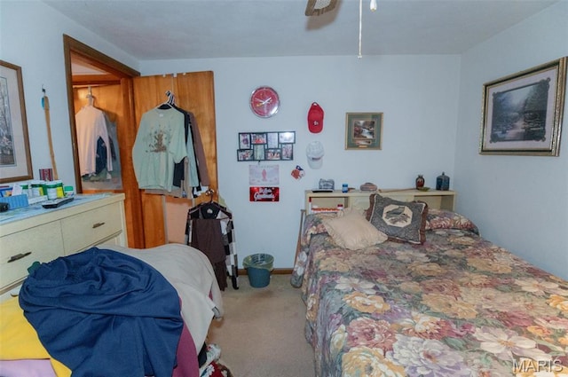 carpeted bedroom with ceiling fan