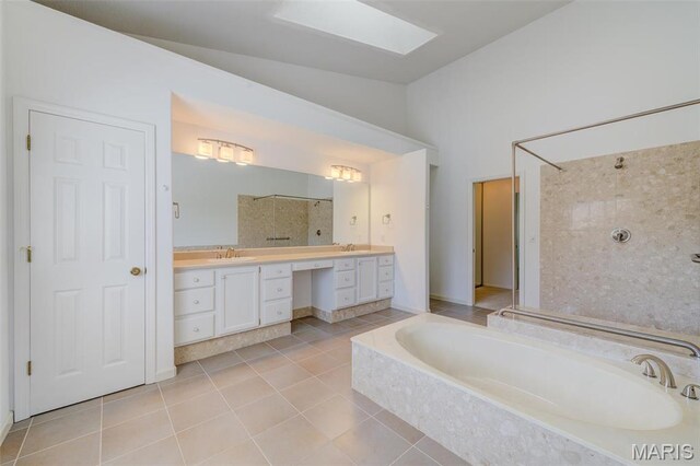 228 Hemingway Ln Unit F, Weldon Spring, MO 63304 - full bathroom with vaulted ceiling, tile patterned flooring, a bath, a tile shower, and vanity