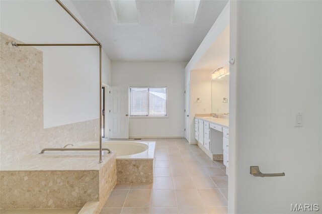 228 Hemingway Ln Unit F, Weldon Spring, MO 63304 - bathroom featuring a bath, vanity, and tile patterned floors