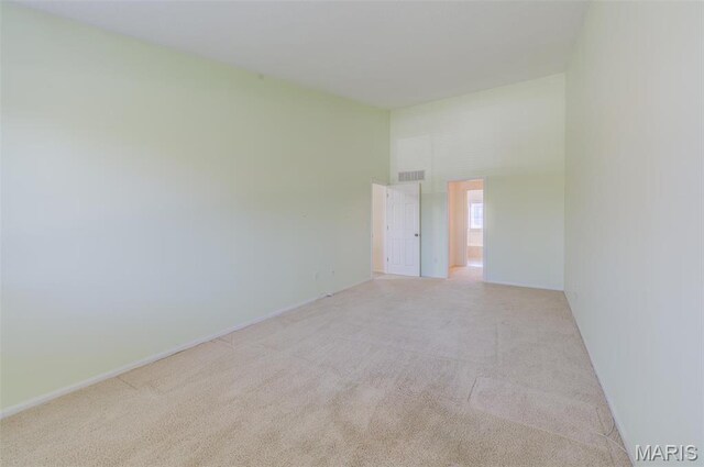 228 Hemingway Ln Unit F, Weldon Spring, MO 63304 - spare room featuring light colored carpet and baseboards