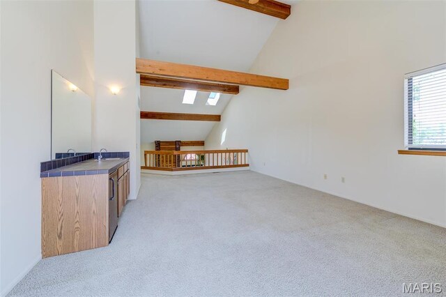 228 Hemingway Ln Unit F, Weldon Spring, MO 63304 - bonus room with beamed ceiling, high vaulted ceiling, light colored carpet, a skylight, and a sink