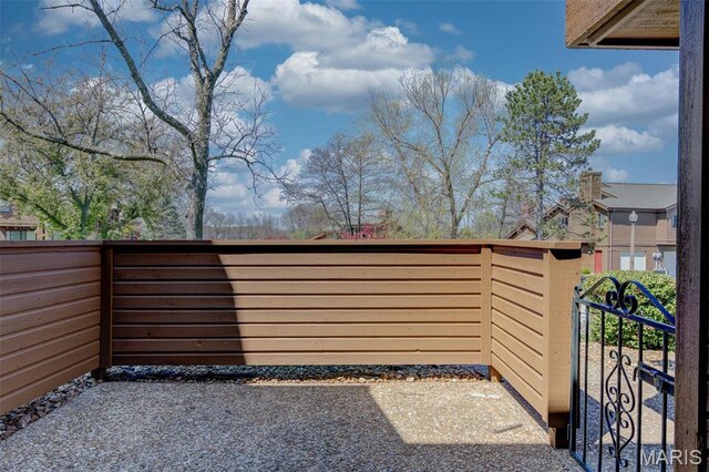 228 Hemingway Ln Unit F, Weldon Spring, MO 63304 - view of patio with a gate and fence