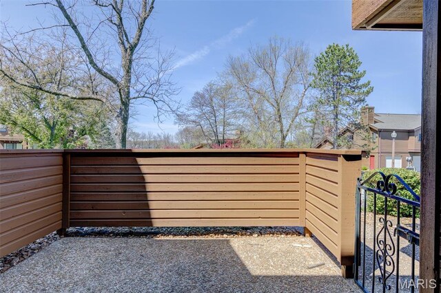 228 Hemingway Ln Unit F, Weldon Spring, MO 63304 - view of patio featuring a gate and fence