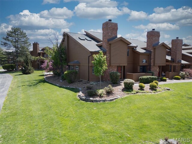 228 Hemingway Ln Unit F, Weldon Spring, MO 63304 - view of side of home featuring a lawn