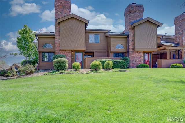 228 Hemingway Ln Unit F, Weldon Spring, MO 63304 - view of front of home with a chimney and a front lawn