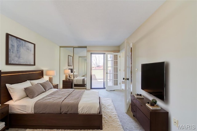228 Hemingway Ln Unit F, Weldon Spring, MO 63304 - bedroom with light carpet and access to outside