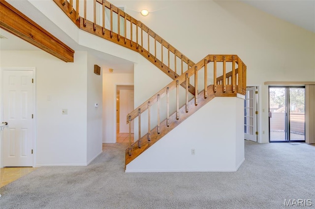 228 Hemingway Ln Unit F, Weldon Spring, MO 63304 - staircase with carpet floors and a high ceiling