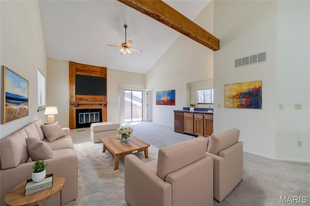 228 Hemingway Ln Unit F, Weldon Spring, MO 63304 - living room featuring high vaulted ceiling, light colored carpet, a ceiling fan, beam ceiling, and healthy amount of natural light