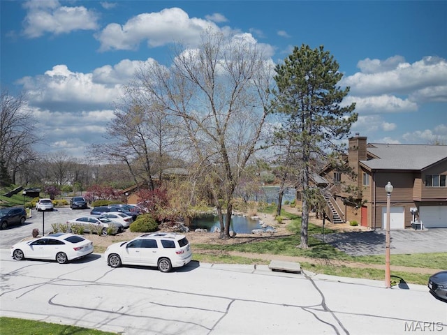 228 Hemingway Ln Unit F, Weldon Spring, MO 63304 - view of asphalt road featuring stairs