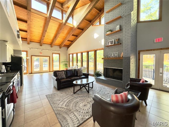 228 Hemingway Ln Unit F, Weldon Spring, MO 63304 - living room featuring french doors, high vaulted ceiling, a wood ceiling with exposed beams, light tile patterned floors, and healthy amount of natural light