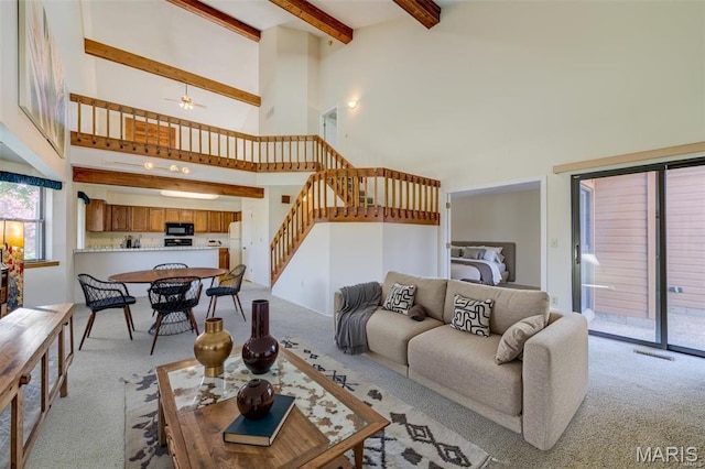 228 Hemingway Ln Unit F, Weldon Spring, MO 63304 - living area with light carpet, stairs, a high ceiling, beamed ceiling, and ceiling fan