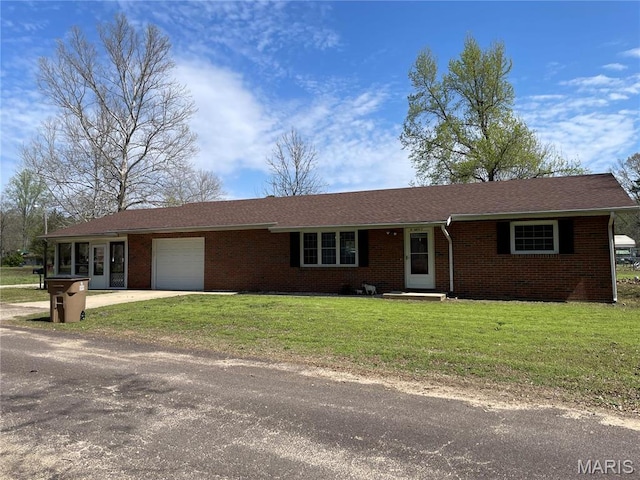 49 S St St, Piedmont, MO 63957 - ranch-style house featuring an attached garage, brick siding, concrete driveway, and a front yard