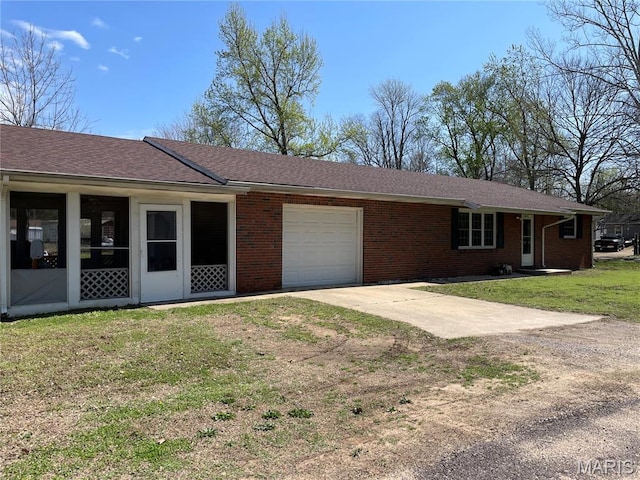 49 S St St, Piedmont, MO 63957 - single story home with driveway, a garage, a front yard, and brick siding