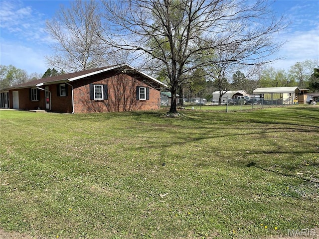 49 S St St, Piedmont, MO 63957 - view of property exterior featuring a carport and brick siding
