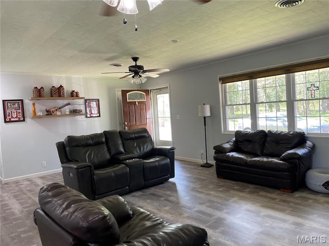 49 S St St, Piedmont, MO 63957 - living area with ceiling fan, wood finished floors, crown molding, and baseboards