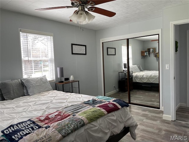 49 S St St, Piedmont, MO 63957 - bedroom featuring a closet, wood finished floors, ceiling fan, and baseboards