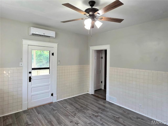 913 Maupin Ave, New Haven, MO 63068 - foyer entrance with tile walls, a wall mounted air conditioner, a wainscoted wall, ceiling fan, and dark wood-style flooring