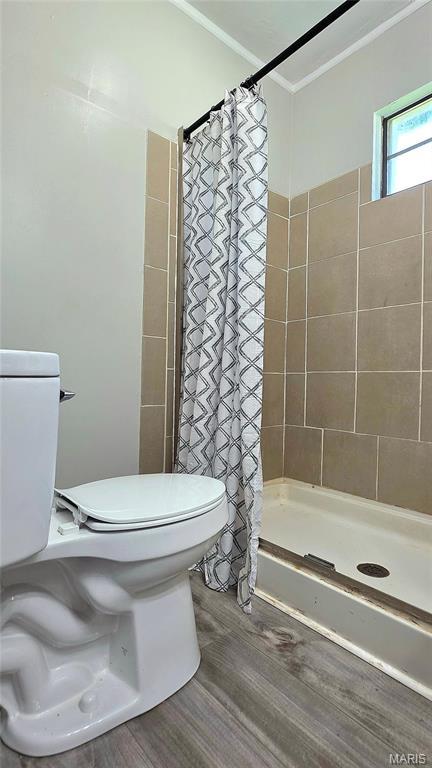 913 Maupin Ave, New Haven, MO 63068 - full bathroom with ornamental molding, a stall shower, wood finished floors, and toilet