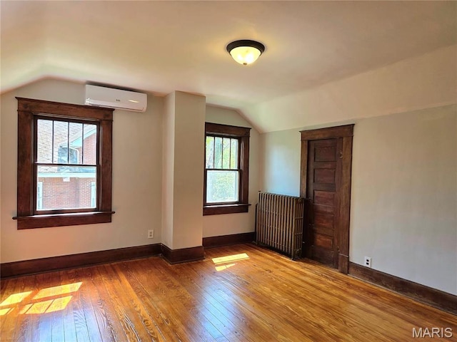 913 Maupin Ave, New Haven, MO 63068 - bonus room featuring a wall mounted AC, lofted ceiling, hardwood / wood-style floors, and baseboards