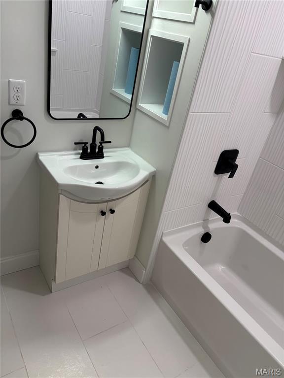 4519 Flora Ave, Saint Louis, MO 63110 - bathroom with tile patterned flooring, vanity, and baseboards