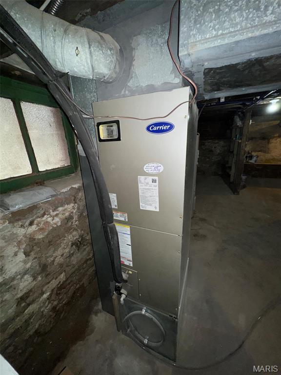 4519 Flora Ave, Saint Louis, MO 63110 - utility room featuring heating unit