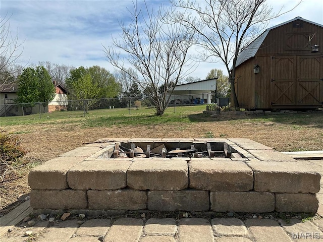 404 Crystal Ln, Rosebud, MO 63091 - view of yard featuring a fire pit, fence, an outdoor structure, and a storage shed
