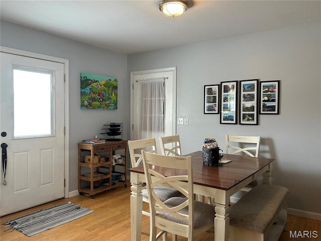 404 Crystal Ln, Rosebud, MO 63091 - dining room featuring light wood-style flooring and baseboards