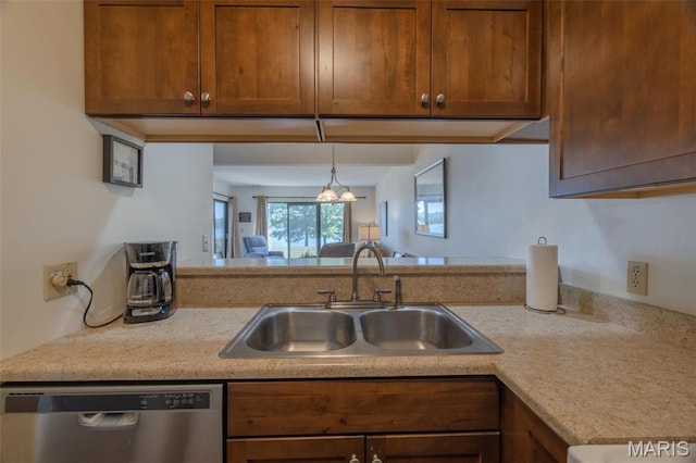 31 N Lionshead Dr, Innsbrook, MO 63390 - kitchen with dishwasher, a sink, light countertops, and brown cabinets