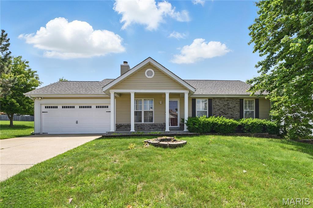 235 Briar Valley Ct S, Saint Charles, MO 63304 - single story home with an attached garage, concrete driveway, a front yard, a chimney, and roof with shingles