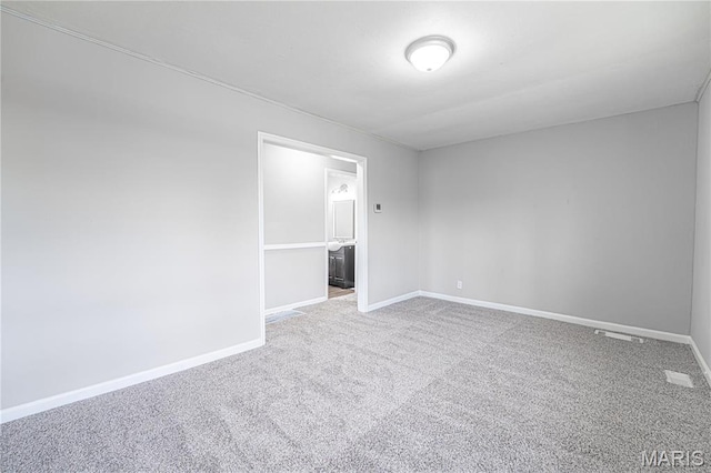 1138 N Washington Ave, Union, MO 63084 - carpeted empty room featuring baseboards