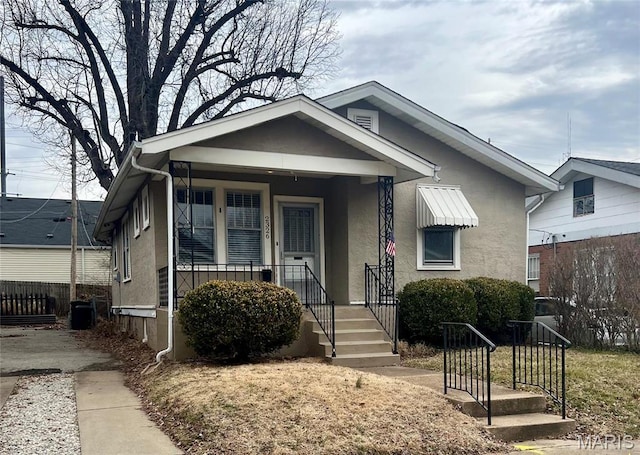 2326 Patton Ave, Saint Louis, MO 63144 - view of front of home featuring stucco siding and covered porch