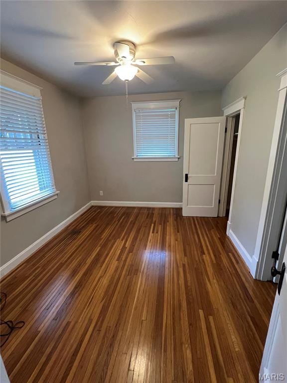 2326 Patton Ave, Saint Louis, MO 63144 - unfurnished bedroom featuring hardwood / wood-style flooring, multiple windows, baseboards, and ceiling fan