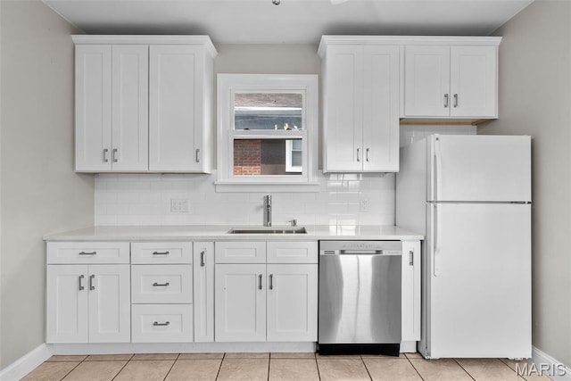2326 Patton Ave, Saint Louis, MO 63144 - kitchen with freestanding refrigerator, dishwasher, a sink, and white cabinets