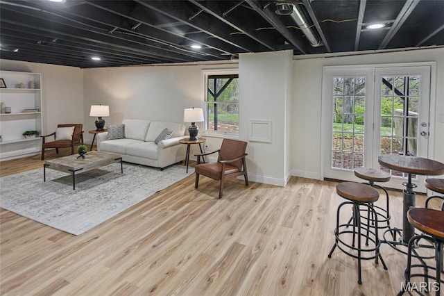 living room with wood finished floors and baseboards
