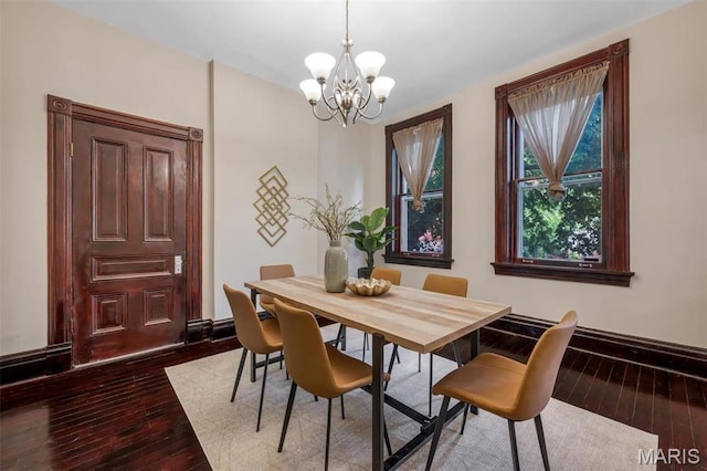 2811 Pennsylvania Ave, Saint Louis, MO 63118 - dining area featuring a chandelier, wood-type flooring, and baseboards